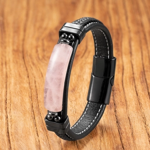 Macro detail of men's leather bracelet with pink natural stone and magnetic steel clasp