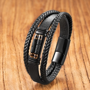 Detailed close-up of multi-layer tiger eye stone leather bracelet with black magnetic clasp