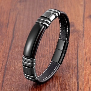 Men's vintage black leather bracelet with stainless steel clasp on wood background
