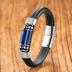 Detail of double-layer black braided leather bracelet with blue stone and magnetic clasp
