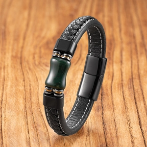 Close-up of men's braided leather bracelet with dark green stone and steel clasp