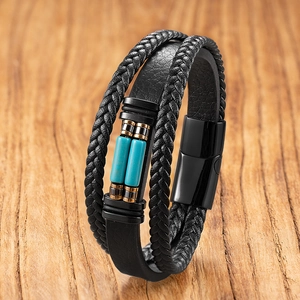 Detail of multi-layer braided leather bracelet with tiger eye stones and magnetic clasp
