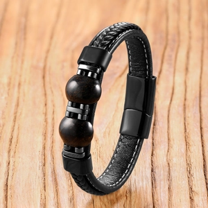 Detailed close-up of men's leather tiger eye bead bracelet with black magnetic clasp