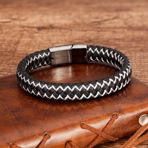 Close-up of woven leather men's bracelet with a brushed gunmetal magnetic clasp