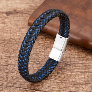 Macro shot of blue and black braided leather bracelet with brushed metal magnetic clasp