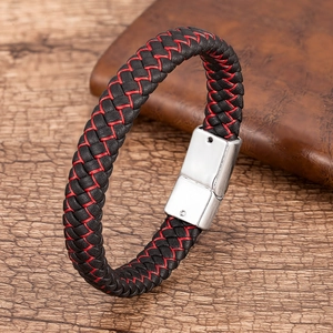 Detail of red and black braided leather bracelet with polished silver magnetic clasp