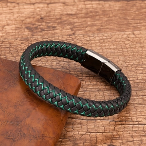 Braided black leather bracelet with vibrant green stitching and magnetic metal clasp