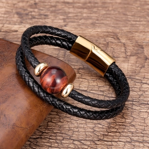 Double-layered black braided leather bracelet with golden magnet clasp and red stone