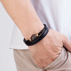 Men's double-layered braided leather bracelet with a red-brown stone and gold metal rings