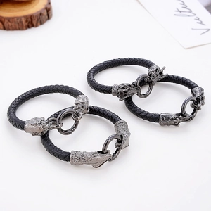 Men's braided leather bracelet with silver dragon metal charm and round clasp