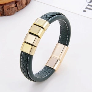 Detail of green braided leather bracelet with gold metal sliders and magnetic buckle