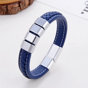 Macro shot of dark blue braided leather bracelet featuring polished silver magnetic clasp