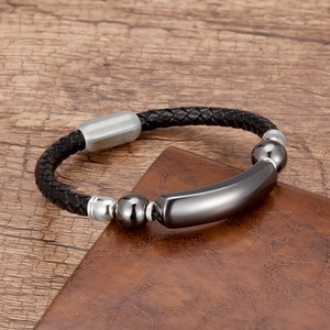 Close-up of men's black braided leather bracelet with silver and gunmetal polished beads
