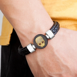 Men's punk skull bracelet with black braided leather and sparkling crystal accents