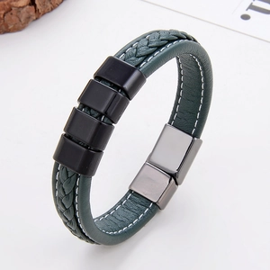 Detail shot of men's navy blue braided leather bracelet with silver magnetic metal clasp