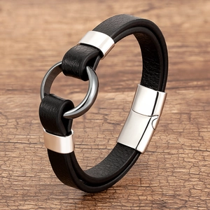 Close-up of double-layer black braided leather bracelet with silver magnetic metal clasp