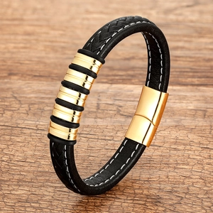 Braided black leather bracelet with gold magnetic metal clasp and white stitching detail