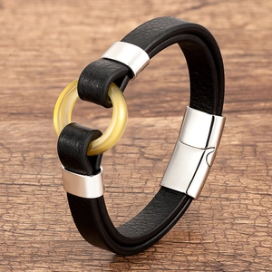 Men's braided black leather bracelet with amber resin ring and magnetic steel clasp