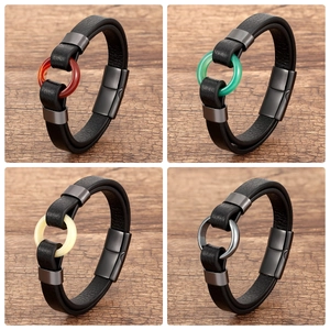 Detail view of woven leather bracelets with colorful stone beads and magnetic metal clasp
