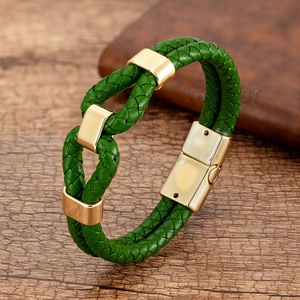 Detail of green leather woven bracelet with gold polished magnetic metal closure