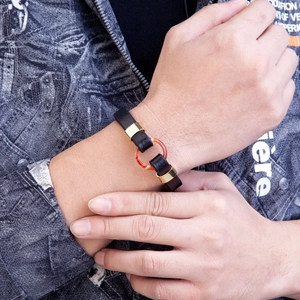 Men's black braided leather bracelet with magnetic gold clasp and red agate stone ring