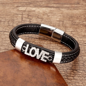 Detail of multi-layer black leather bracelet with crystal LOVE letter and metal clasp