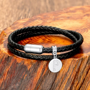 Close-up of black braided leather double bracelet with silver magnetic clasp and P pendant