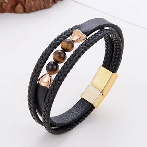 Macro detail of multi-layer leather bracelet with tiger eye stones and magnetic clasp