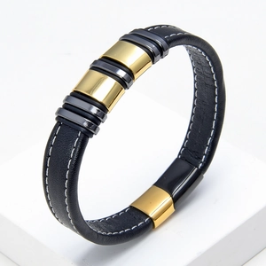 Close-up of black braided leather bracelet with contrast stitching and metallic clasps