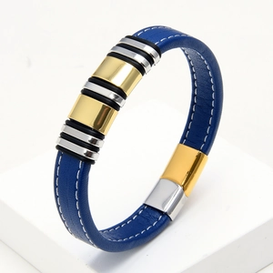 Detail view of blue textured leather bracelet with gold and silver metal rings