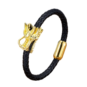 Ethnic stainless steel dragon head bracelet with black braided leather and gold magnetic clasp