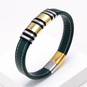Detail of dark green leather bracelet with white stitching and gold silver metal rings