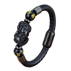 Ethnic Pi Xiu black leather bracelet with Mantra beads and magnetic clasp on white background