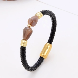 Braided leather bracelet with gold magnetic clasp and natural brown stone accents