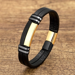 Men's braided black leather bracelet with polished gold and gunmetal decorative accents
