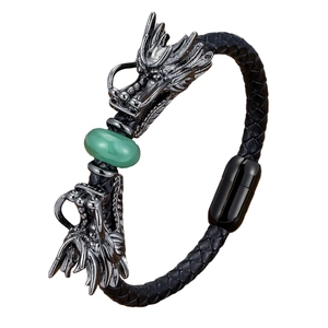 Men's leather bracelet featuring silver dragon heads and a green bead with magnetic clasp