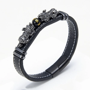 Men's leather bracelet with PiXiu charms and gold-tone mantra bead on white background