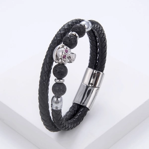 Detail of skull leather bracelet with black lava stones and magnetic steel clasp