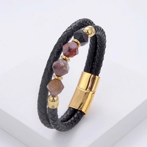 Detail of men's braided leather bracelet with natural stone beads and gold magnetic clasp
