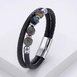 Close-up of double-layer braided leather bracelet with natural stones and magnetic clasp