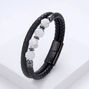 Detail view of double-layer black woven leather bracelet with white marble stone inserts
