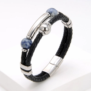 Detail shot of black braided leather bracelet with blue marble beads and magnetic clasp