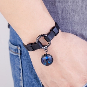 Libra zodiac leather bracelet with blue constellation charm on model's wrist