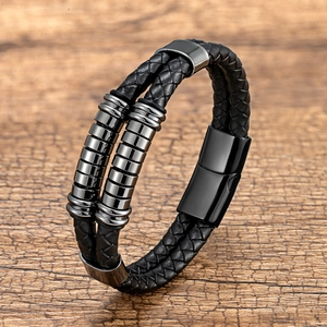 Close-up of double-layer black braided leather bracelet with gunmetal magnetic clasp