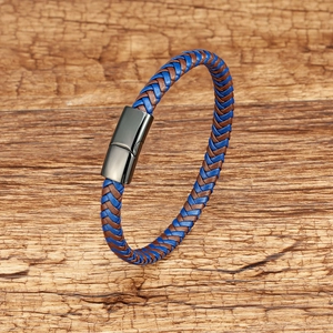 Close-up of woven leather bracelet in blue and brown with a gunmetal magnetic clasp