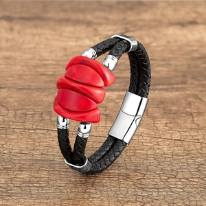 Men's braided leather bracelet with a red stone center and silver magnetic buckle