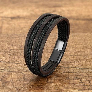 Men's multi-layer braided leather bracelet with vintage magnetic metal clasp on wood