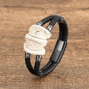 Detail view of woven leather bracelet with marble texture stones and magnetic steel clasp