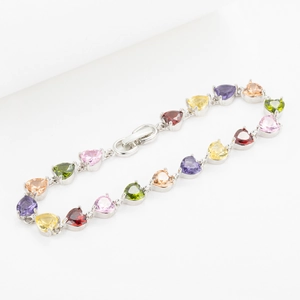 Luxurious silver bracelet with colorful heart-shaped cubic zirconia gemstones in a claw setting