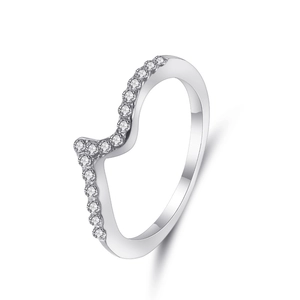 Detail of wave-shaped silver ring featuring a curved line of shimmering cubic zirconia
